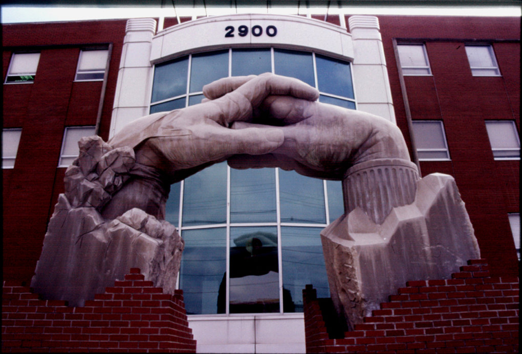 Opportunity Portal  Meg White Sculpture Studios, Inc. ©2000 15'H x 20'L x 5'W Indiana Limestone Two hands, one representing the community and the other representing the  Nia Center, come together to create the Opportunity Portal.