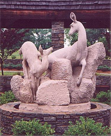 Sculpture by Meg White, Doe & fawn crossing stream.
